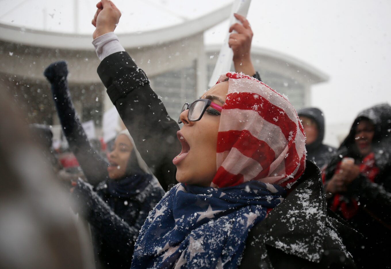 Khulud Fidama, 26, of Dearborn, Mich., stands with her family outside the McNamara Terminal...