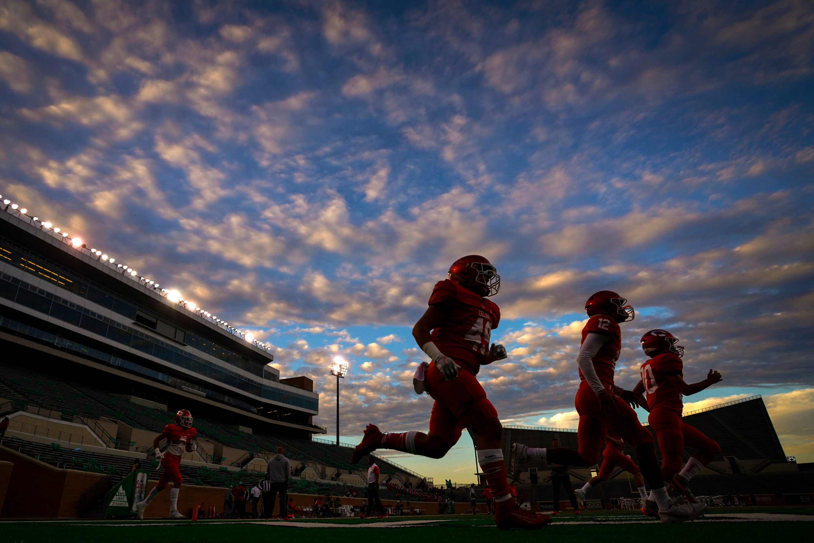 Celina player warm up before a Class 4A Division II Region I semifinal playoff high school...