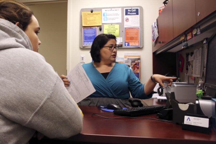 Academic adviser Soyla Santos helps student Krystle Gelston with schedule changes at the...