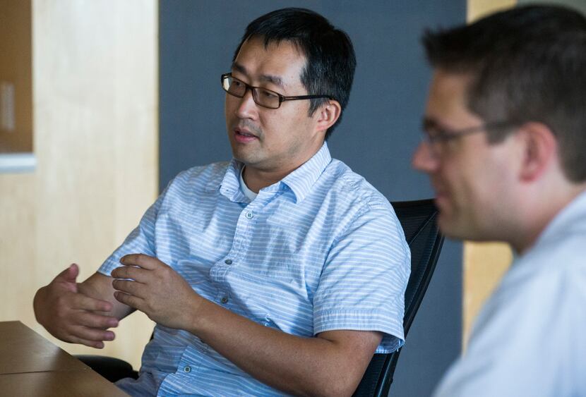 UT-Arlington associate professor of computer science and engineering Chengkai Li (left) and...