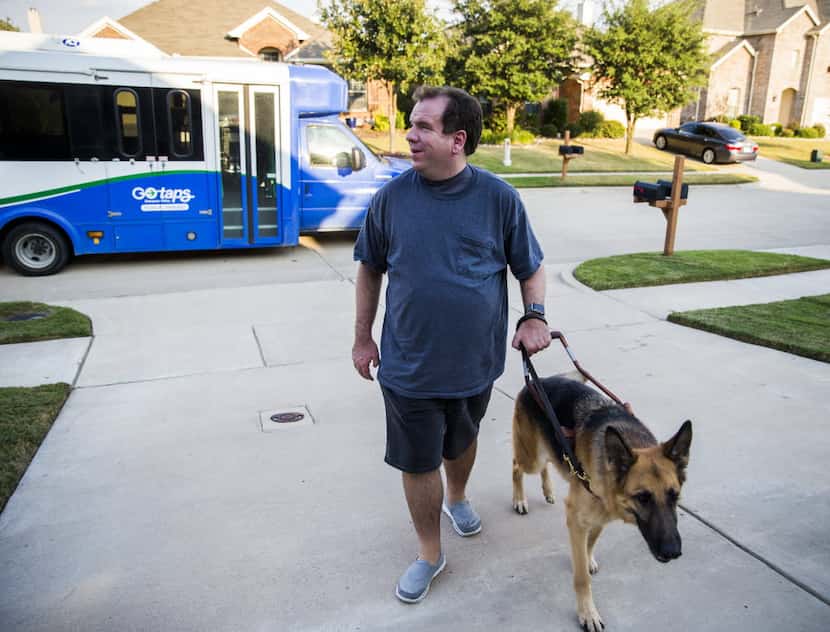 Justin Mann and his guide dog, Garvey, arrived home after a TAPS Public Transit bus ride on...
