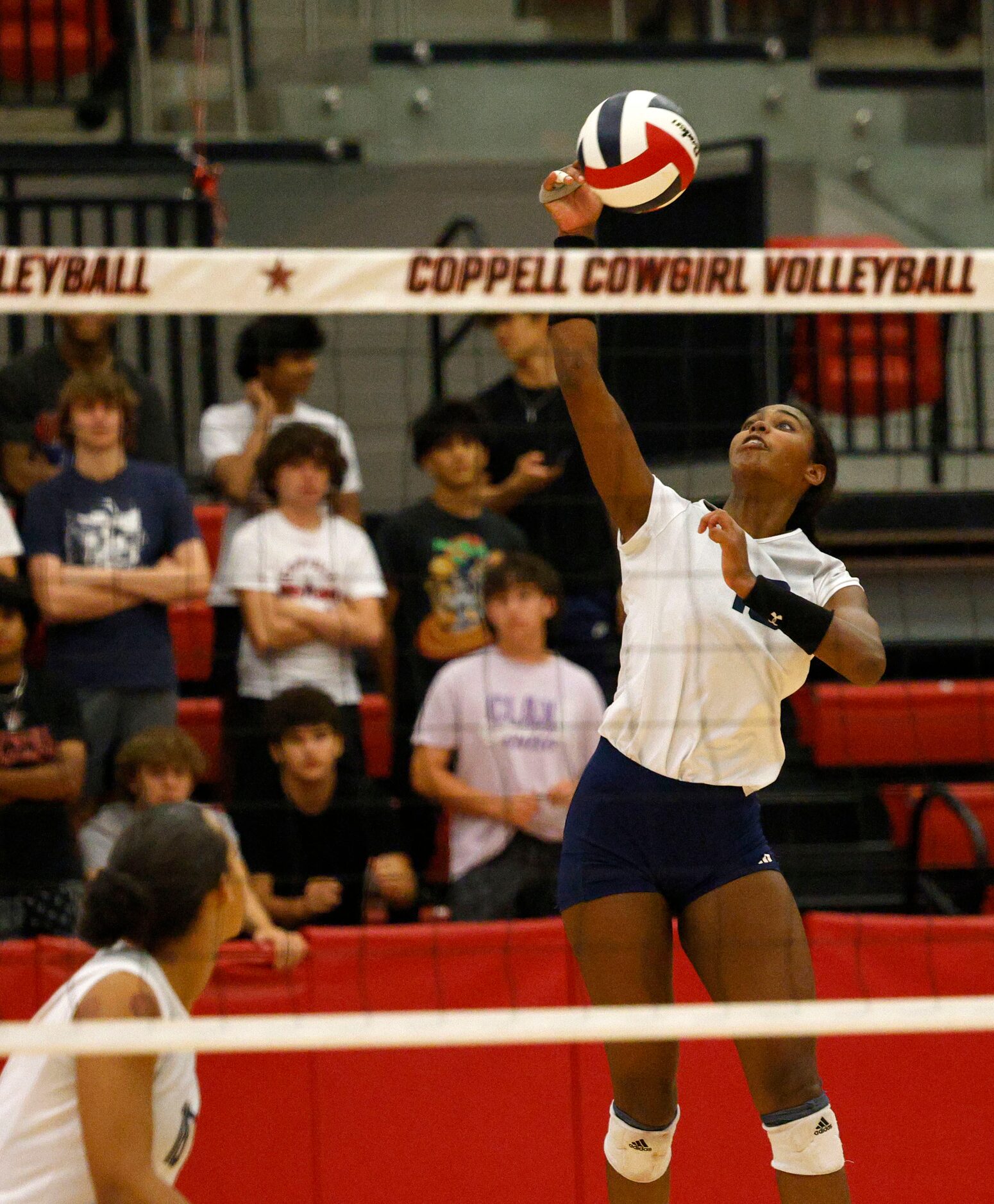 Flower Mound's Brianna Watson (13) spikes the ball against Coppell during a high school...