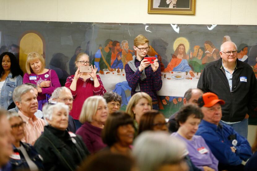 People watch as U.S. Congressman Beto O'Rourke gives a speech at the Brandon Community...