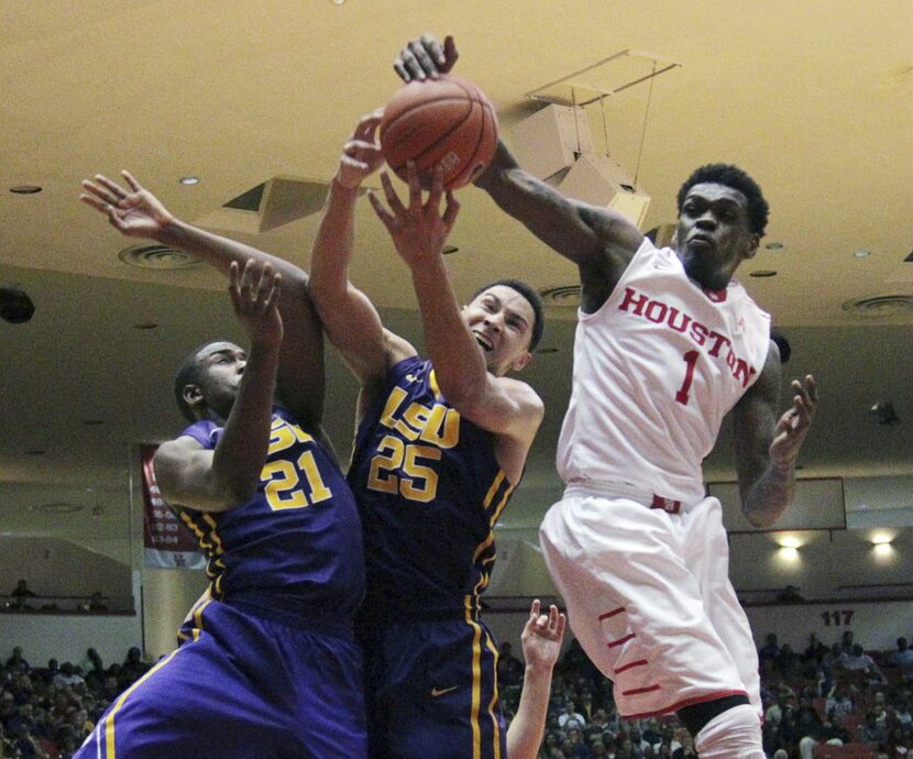 Houston forward Xavier Dupree (1) gets a rebound from LSU  forward Ben Simmons (25) during...