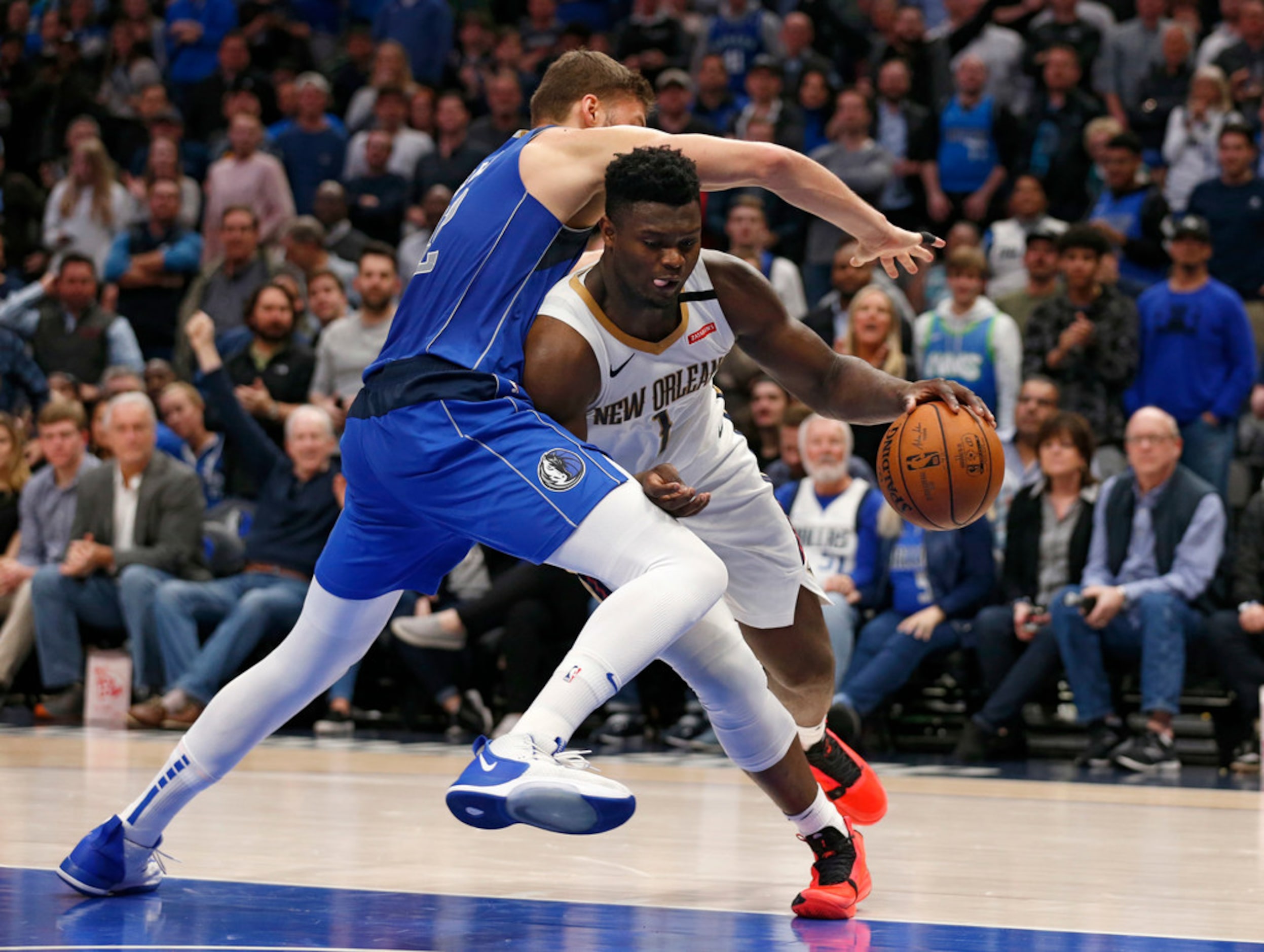 New Orleans Pelicans forward Zion Williamson (1) is fouled by Dallas Mavericks forward Maxi...