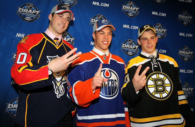 LOS ANGELES, CA - JUNE 25: (L-R) Erik Gudbranson, drafted third overall by the Florida...