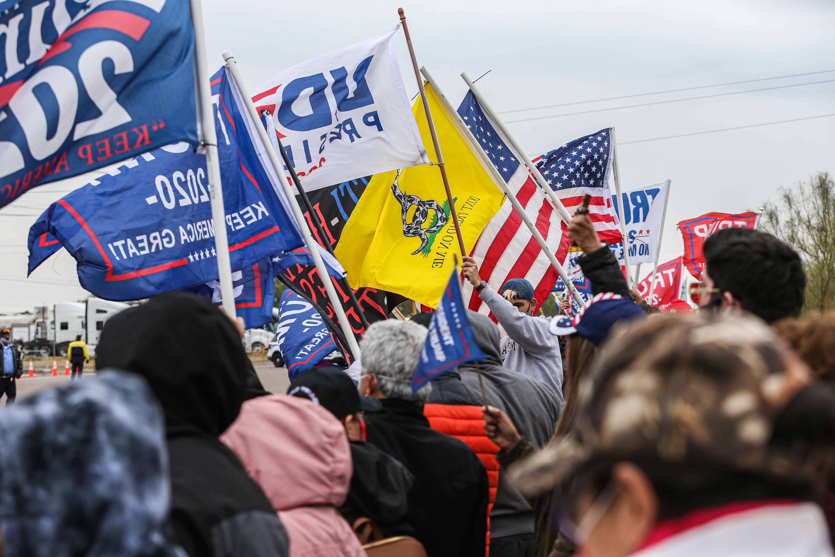 President Donald Trump supporters at S 10th St and Bales Rd during a rally as Trump is...