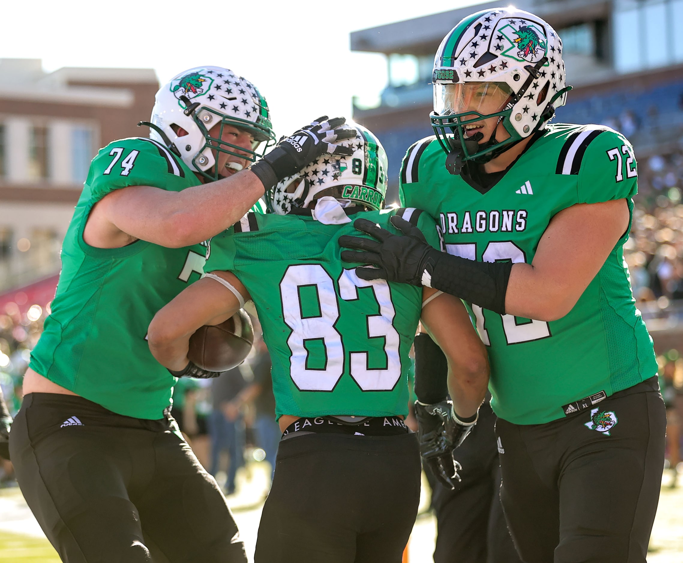 Southlake Carroll running back Christian Glenn (83) celebrates with offensive lineman Luke...