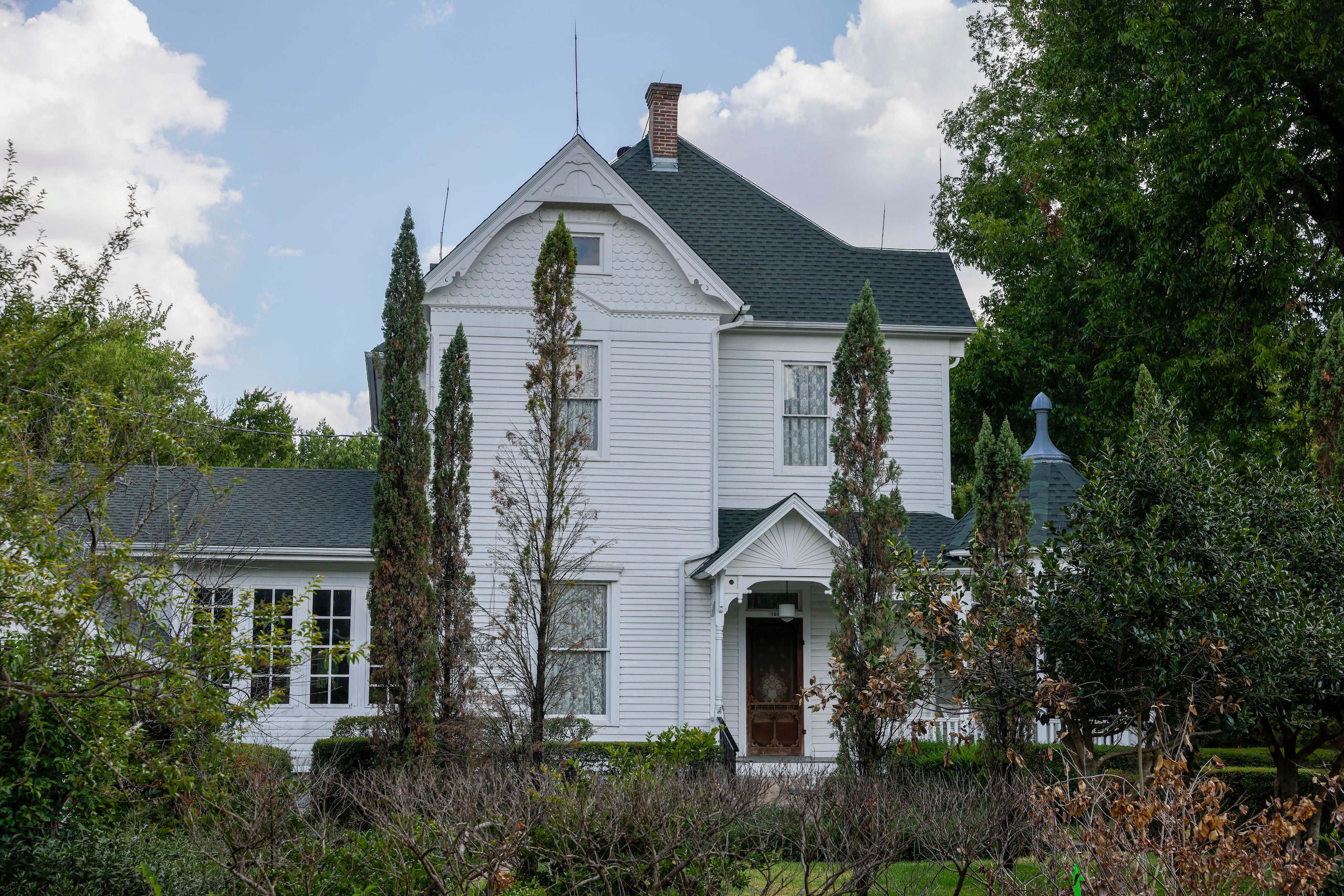 A Victorian-style home is shown near downtown Pilot Point.