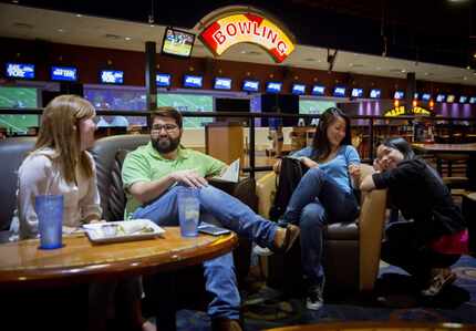  (From left) Laura Auwarter, Gus Olsen, Trinh Nguyen and Kim Hoang hang out at Main Event in...