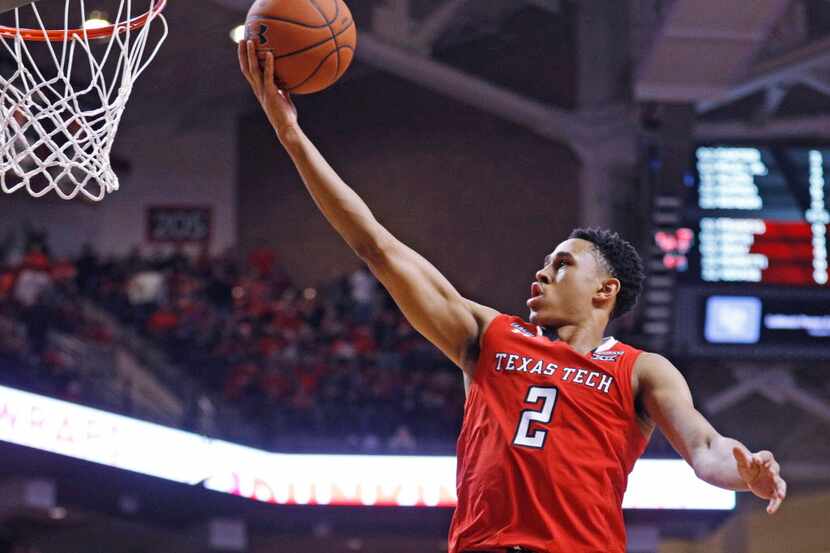 Texas Tech's Zhaire Smith (2) lays up the ball during the first half of an NCAA college...