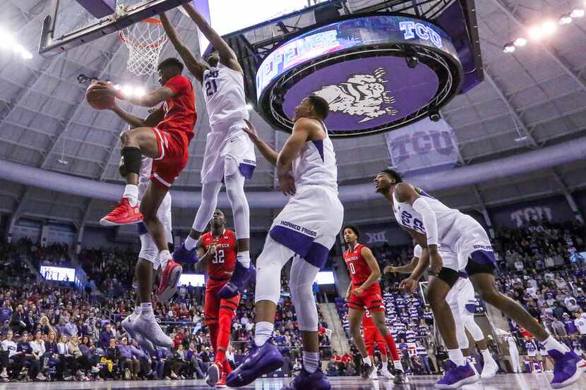 Texas Tech Red Raiders guard Jarrett Culver (23) makes a pass against TCU Horned Frogs...