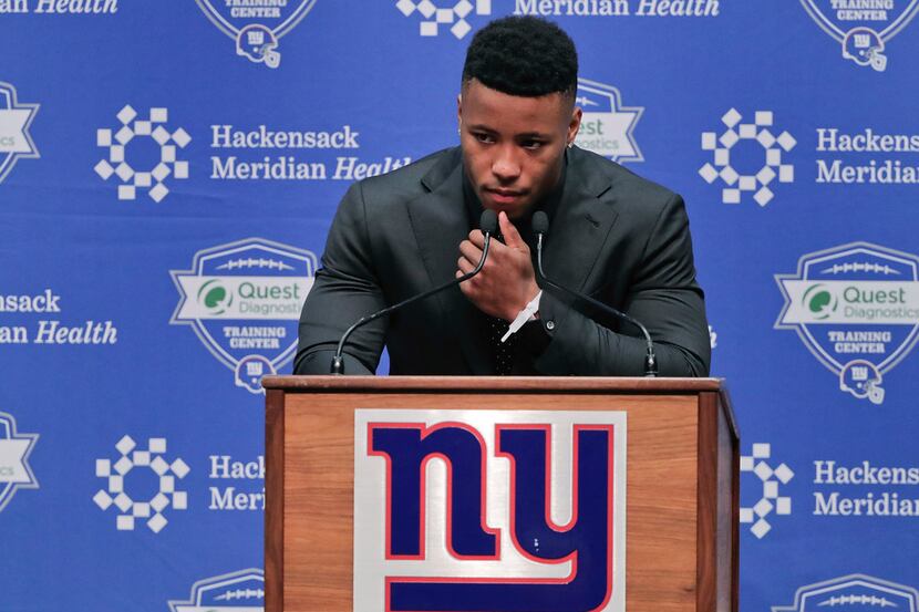 Running back Saquon Barkley answers questions during a news conference, Saturday, April 28,...
