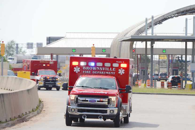 Brownsville Fire Department EMS Ambulances drive through Veterans International Bridge at...