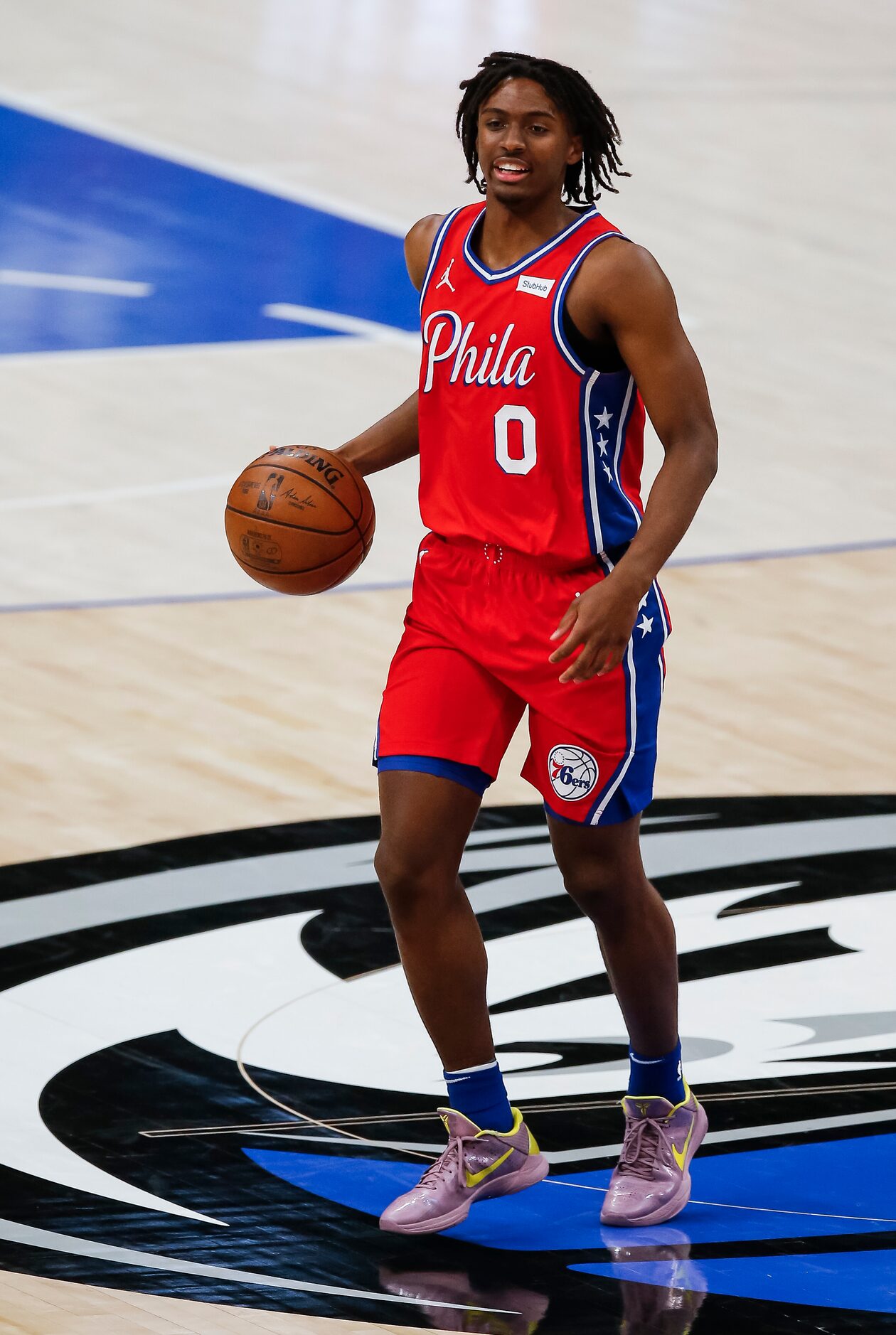 Philadelphia 76ers guard Tyrese Maxey (0) looks for room against the Dallas Mavericks...