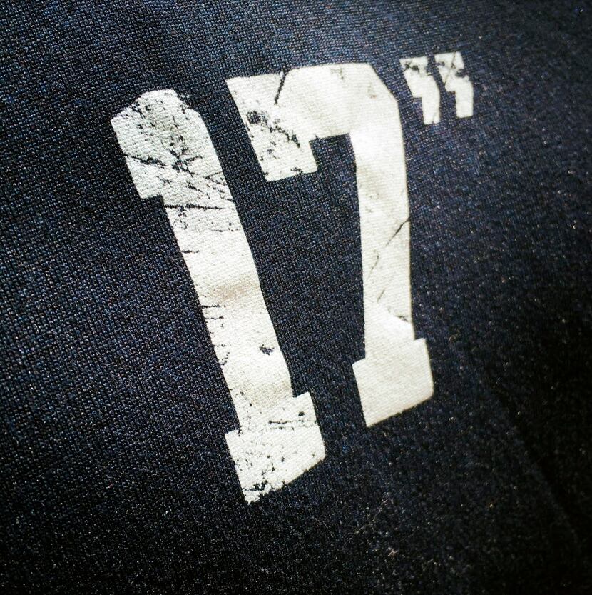 A Dallas Cowboys inspirational 17" log his pictured on a t-shirt  during afternoon practice...