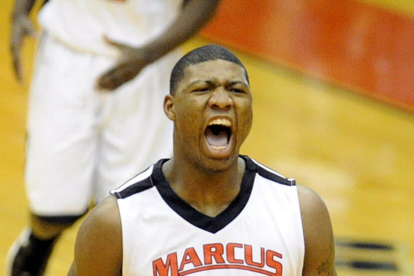 Flower Mound Marcus' Marcus Smart celebrates after a basket in the first half during the...