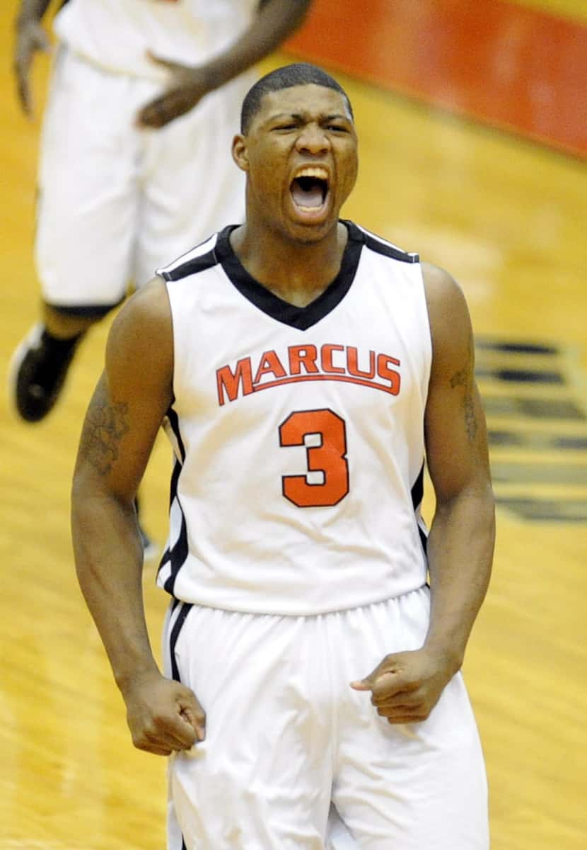 Flower Mound Marcus' Marcus Smart celebrates after a basket in the first half during the...