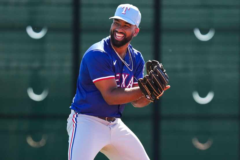 Texas Rangers infielder Ezequiel Duran participates in a spring training workout at the...
