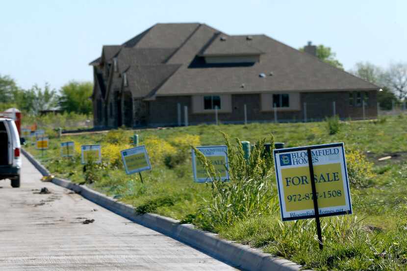 For-sale signs are seen on empty lots in the Hagan Hill development in Mesquite. (Jae S....