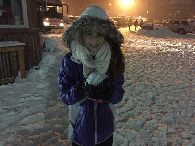 Maddy Pitluk, 10, prepares to tattoo her dad with a snowball.