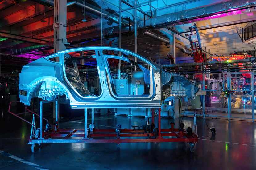 Cars are seen on the assembly line during a tour of the Tesla Giga Texas manufacturing...