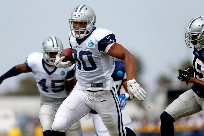 Dallas Cowboys tight end Rico Gathers (80) runs with the ball after making a catch during...