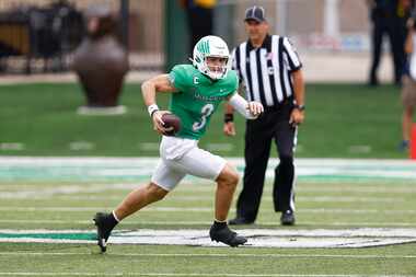 North Texas quarterback Stone Earle (3) carries the ball during the first half of an NCAA...