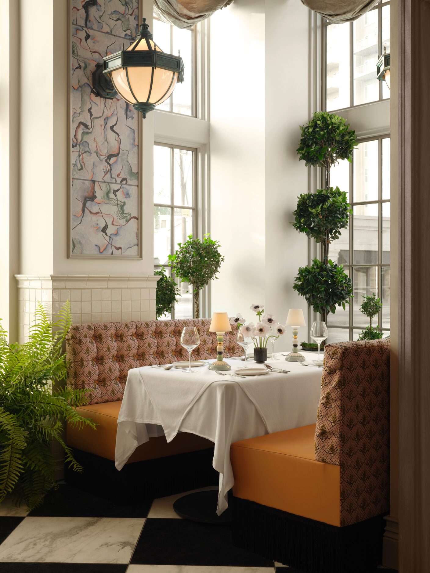 In the former Highland Park Soda Fountain, two booths on either side of the door look out...