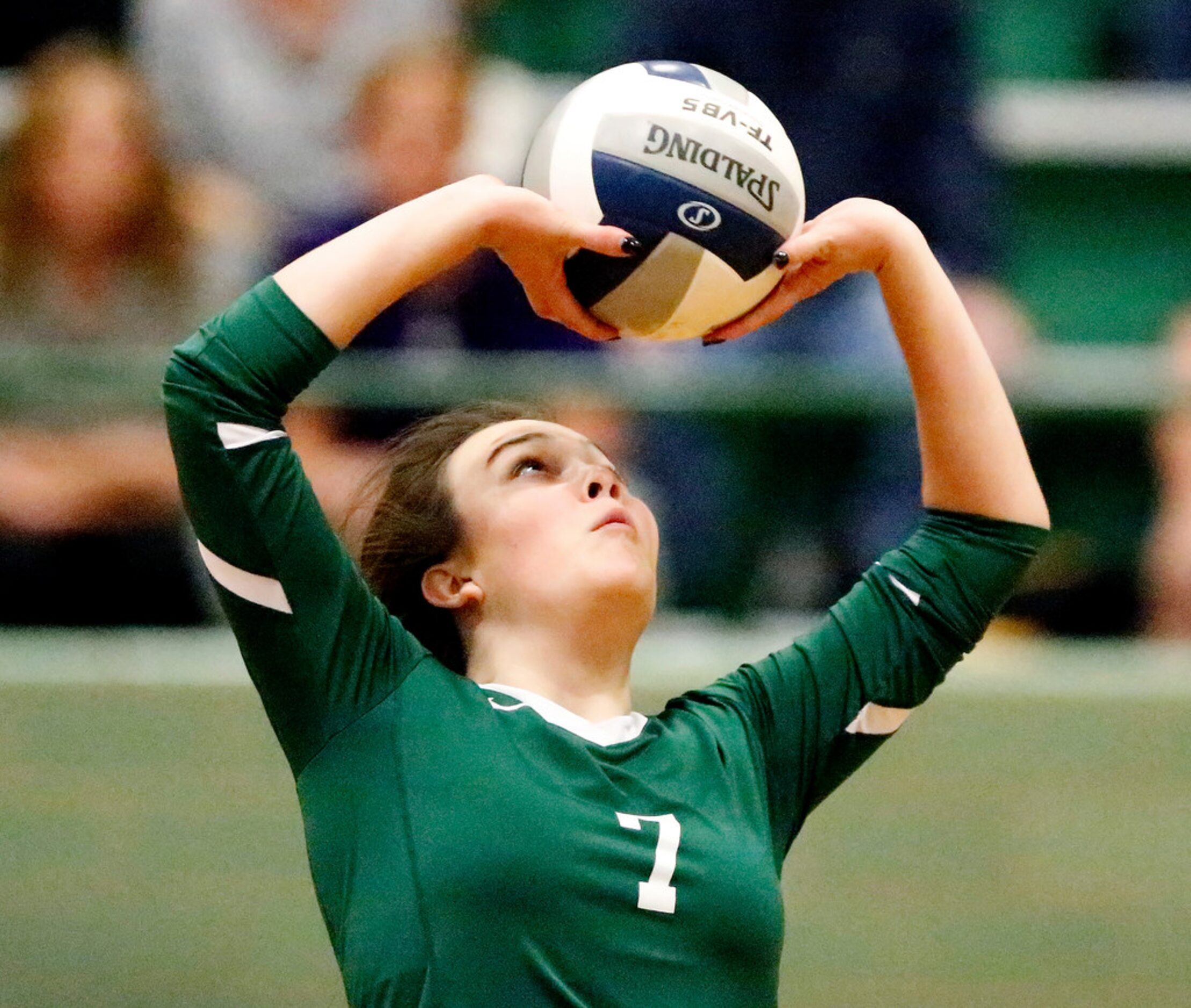 Lebanon Trail High School setter Madison Hatt (7) makes a set during game one as Lebanon...