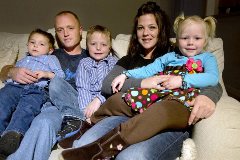 Terance and Megan Wells are shown with their children (from left) Brody, 2,  Braden, 8, and...
