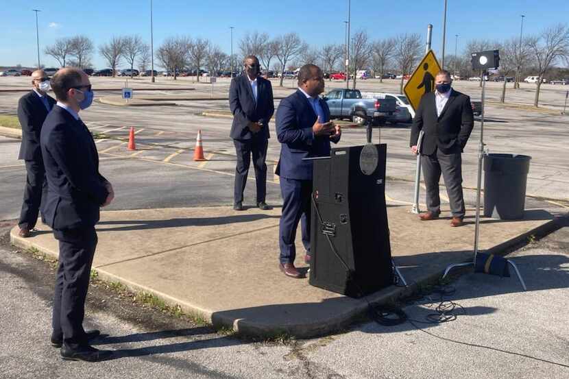 Dallas Mayor Eric Johnson, center, speaks to members of the media Thursday March 4, 2021 at...