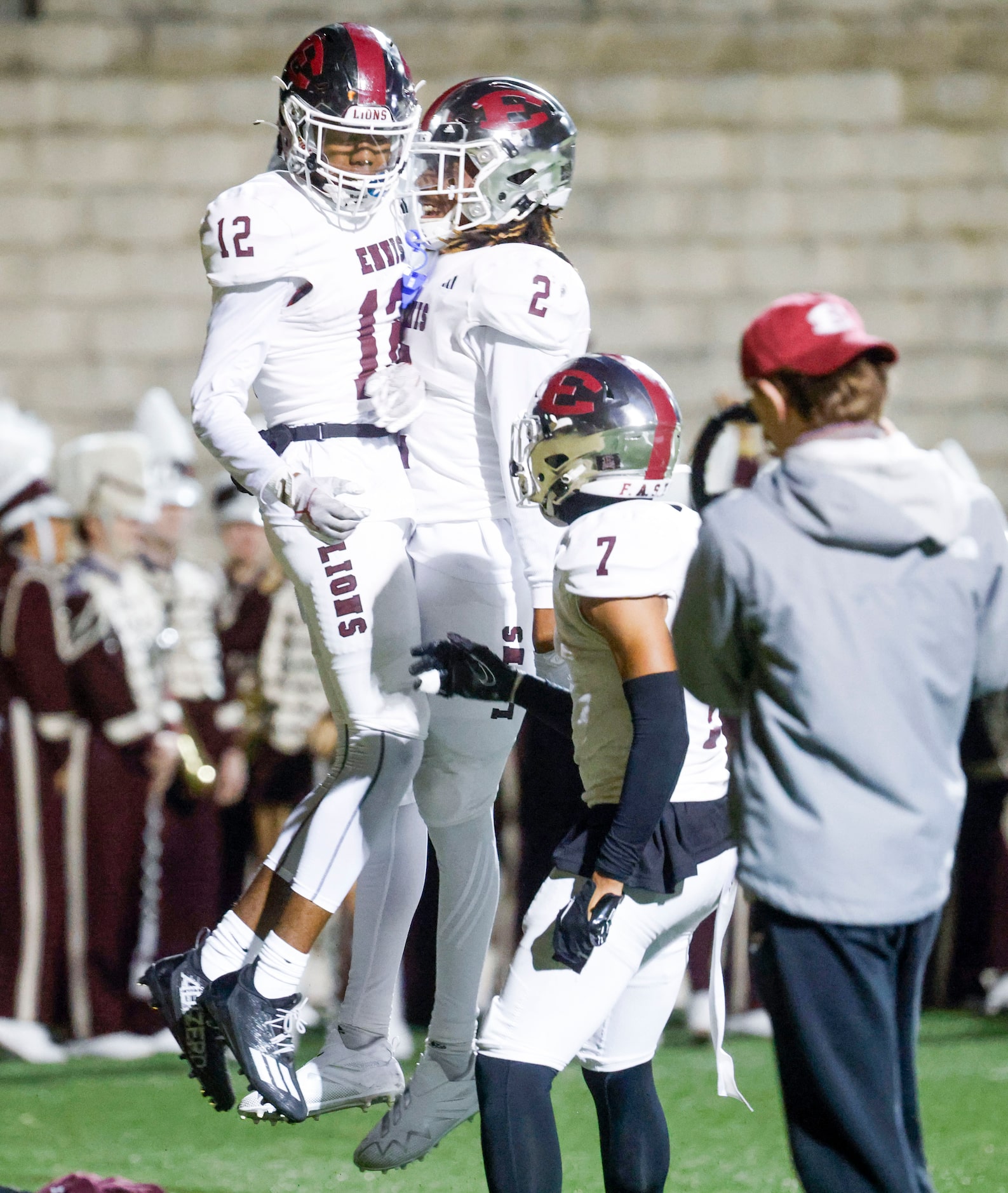 Ennis High’s Taurean Bell (12) celebrates a touchdown with Lamarion  McGowan against...