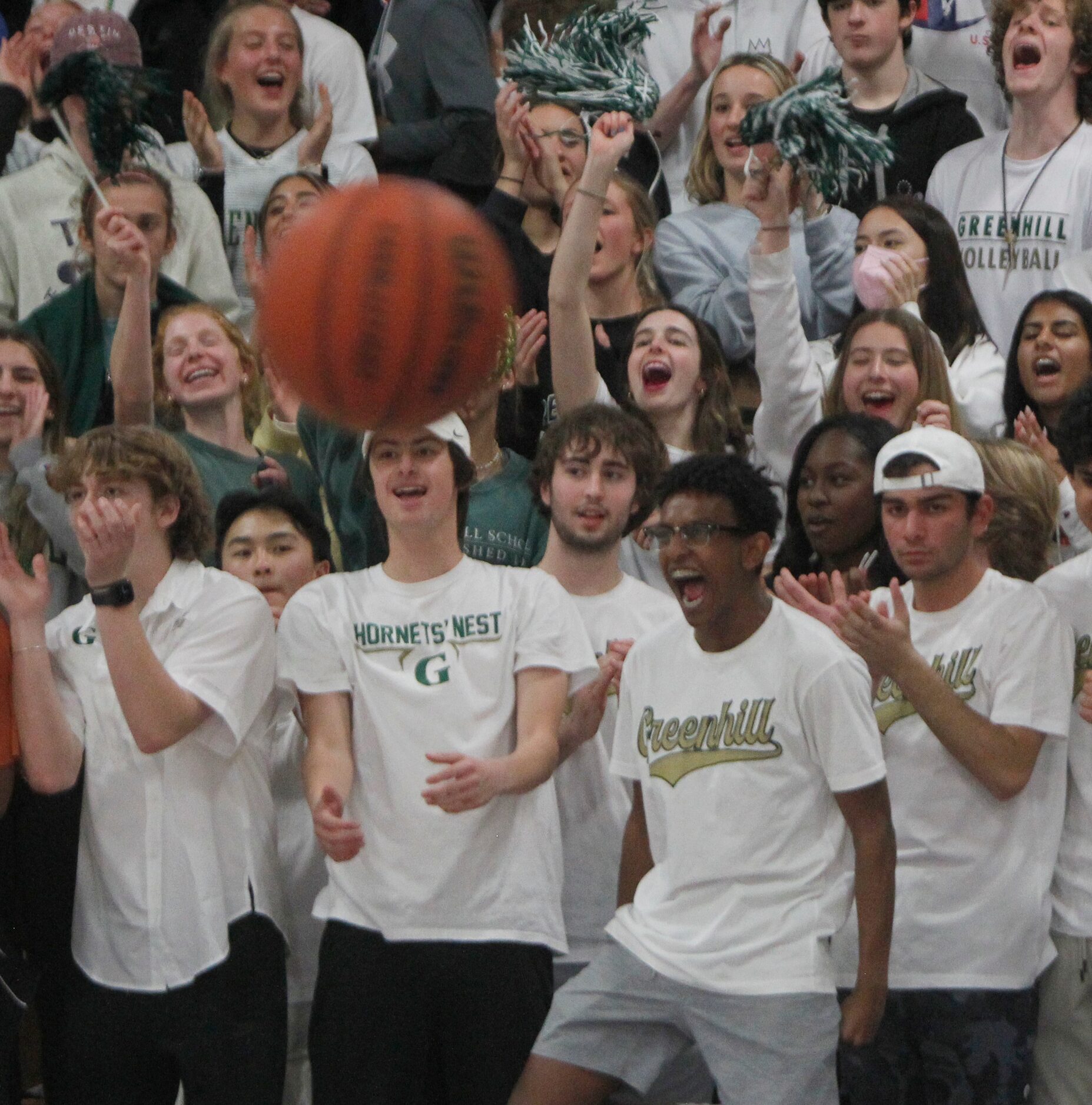 Greenhill fans overfilling the student section express their support following a Hornets...