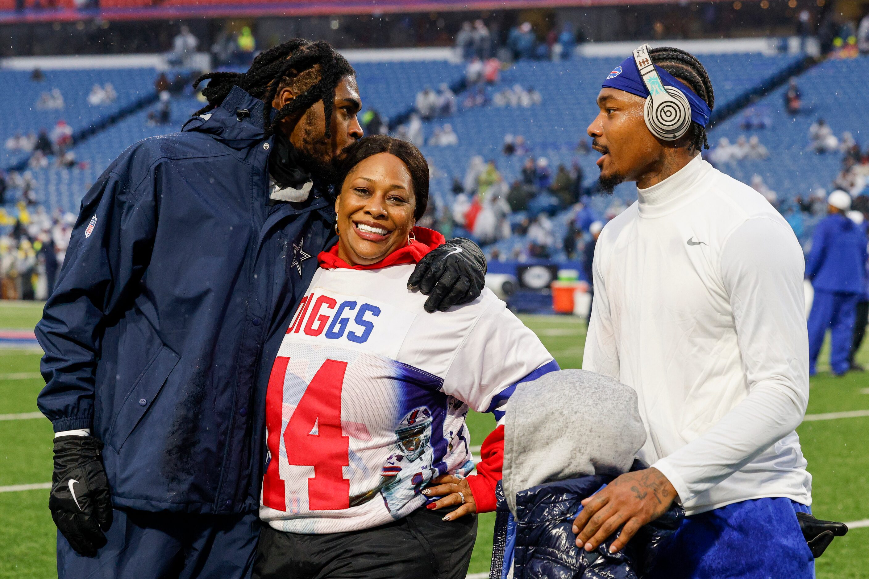 Dallas Cowboys cornerback Trevon Diggs kisses his mother Stephanie Diggs alongside his...