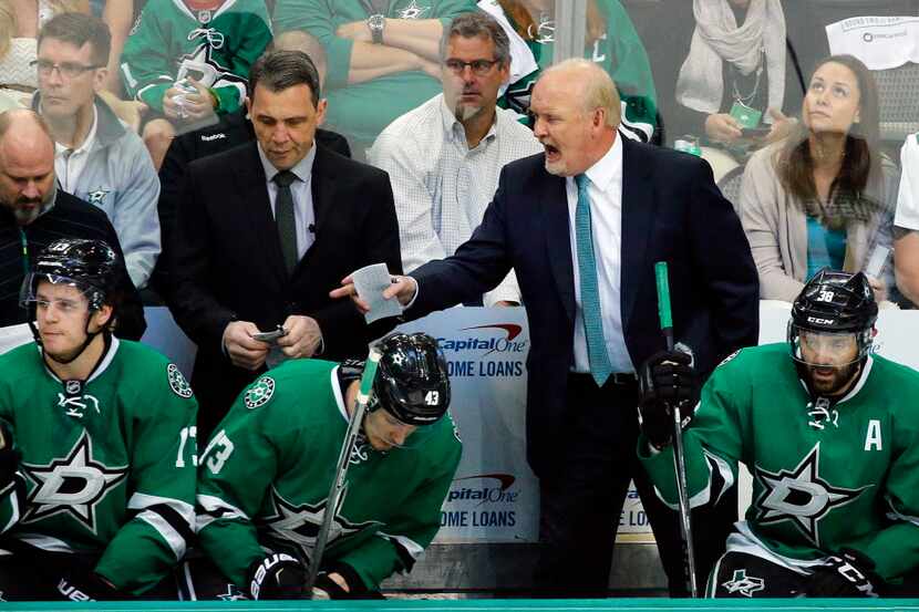 Dallas Stars head coach Lindy Ruff yells at his players in the third period as they faced...