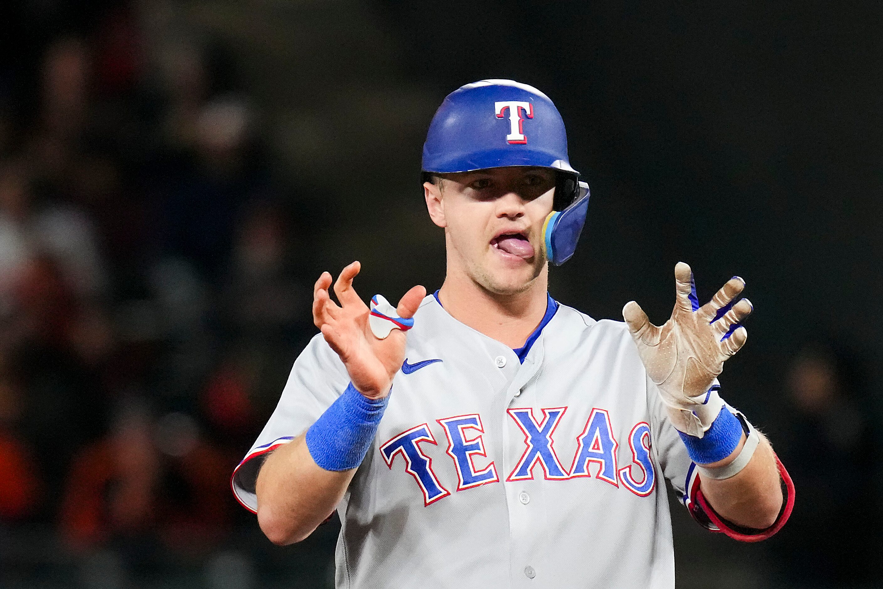 Texas Rangers third baseman Josh Jung celebrates at second base after hitting a double...