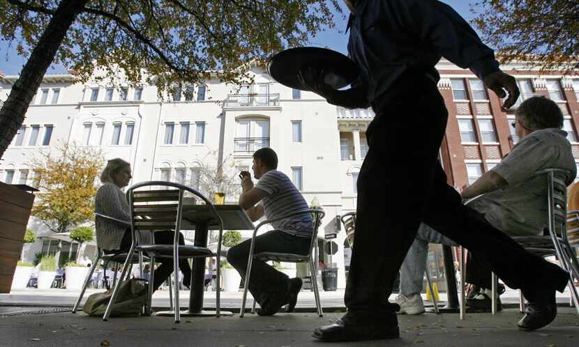 Residents of Uptown and the West Village enjoy a sun-splashed afternoon on the patio of Mi...