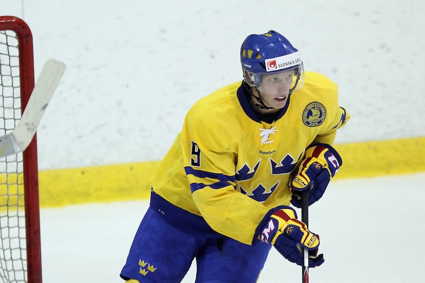 John Klingberg #9 of Team Sweden skates against Team USA at the Lake Placid Olympic Center...