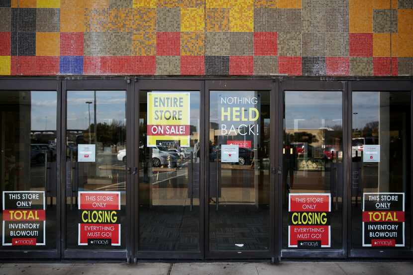Closing signs on the door of Macy's at Collin Creek Mall in Plano, Texas Monday January 1,...
