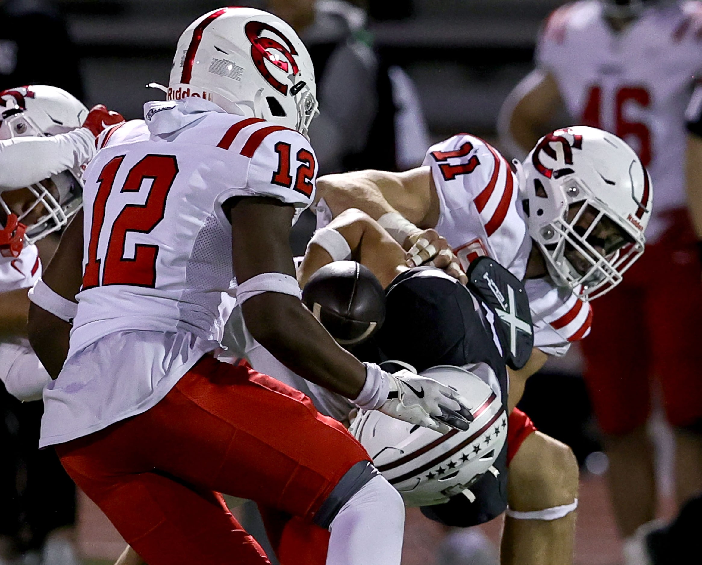 Lewisville wide receiver Traejan Mueller gets stripped on the ball from Coppell linebacker...