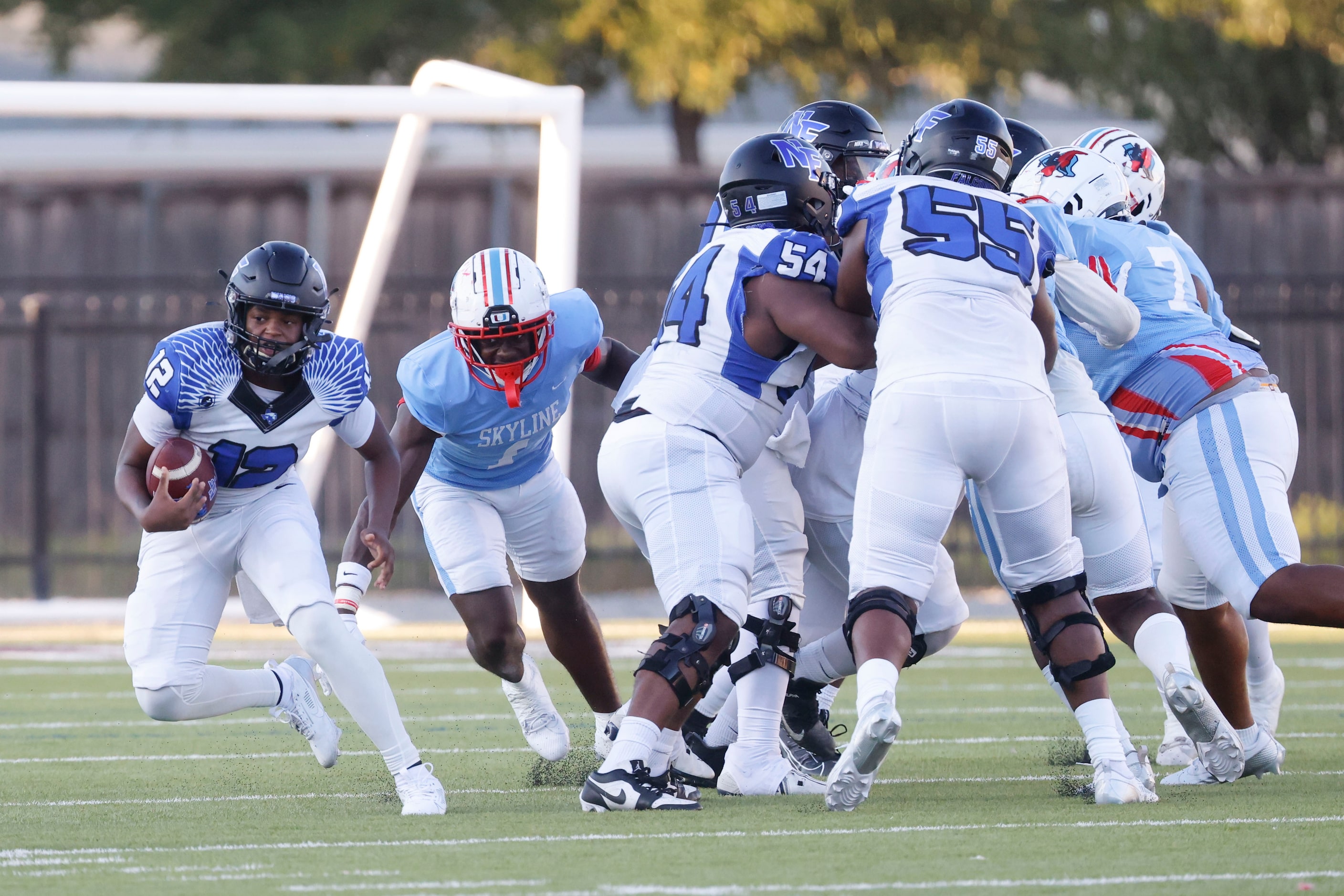 North Forney High’s Michael Douglas (12) moves past Skyline High’s Adam Dweh (1) during the...