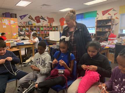 Charlotte Geisler teaches some of her fifth-grade students at Wilmer-Hutchins Elementary...