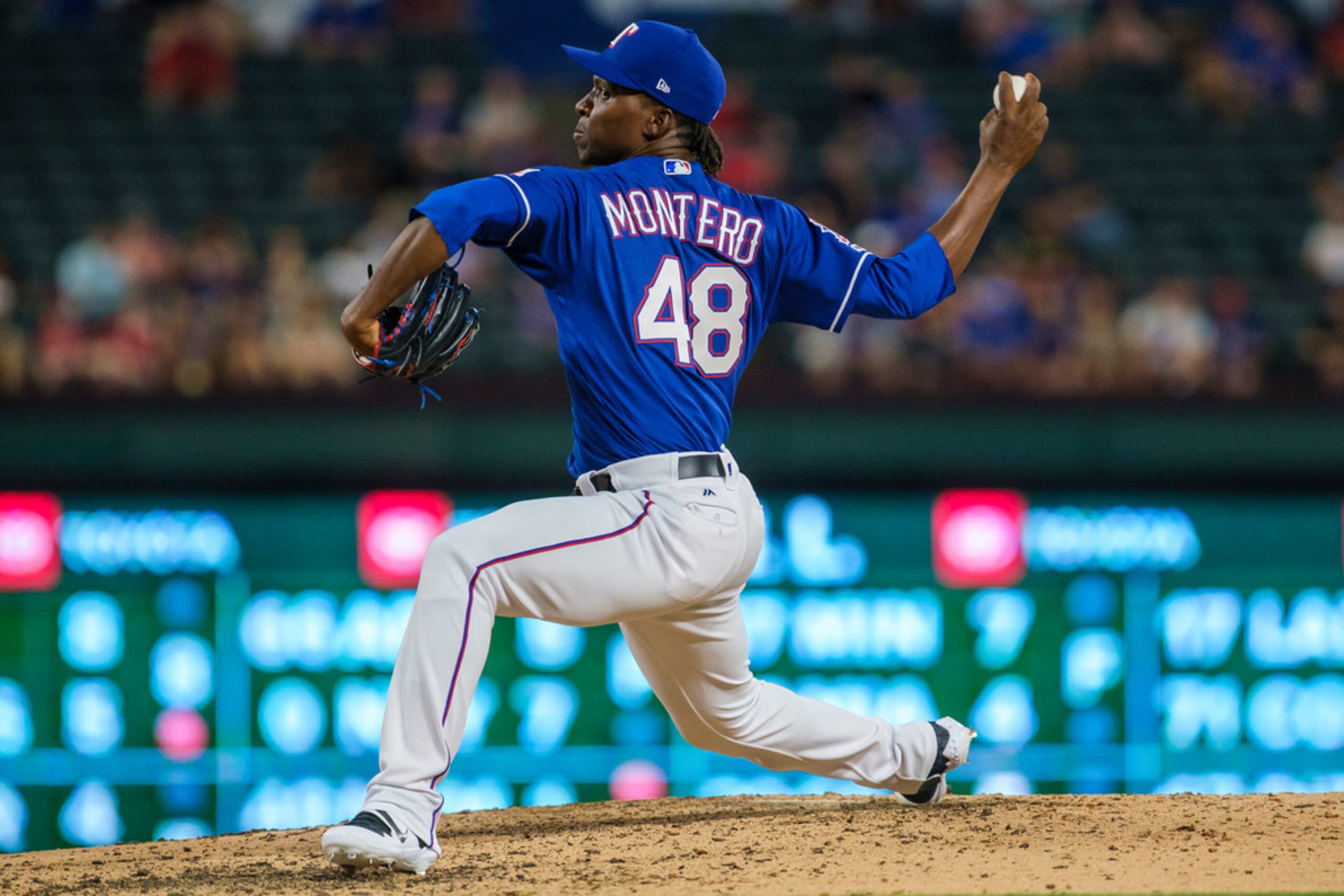 Texas Rangers relief pitcher Rafael Montero pitches during the seventh inning against the...