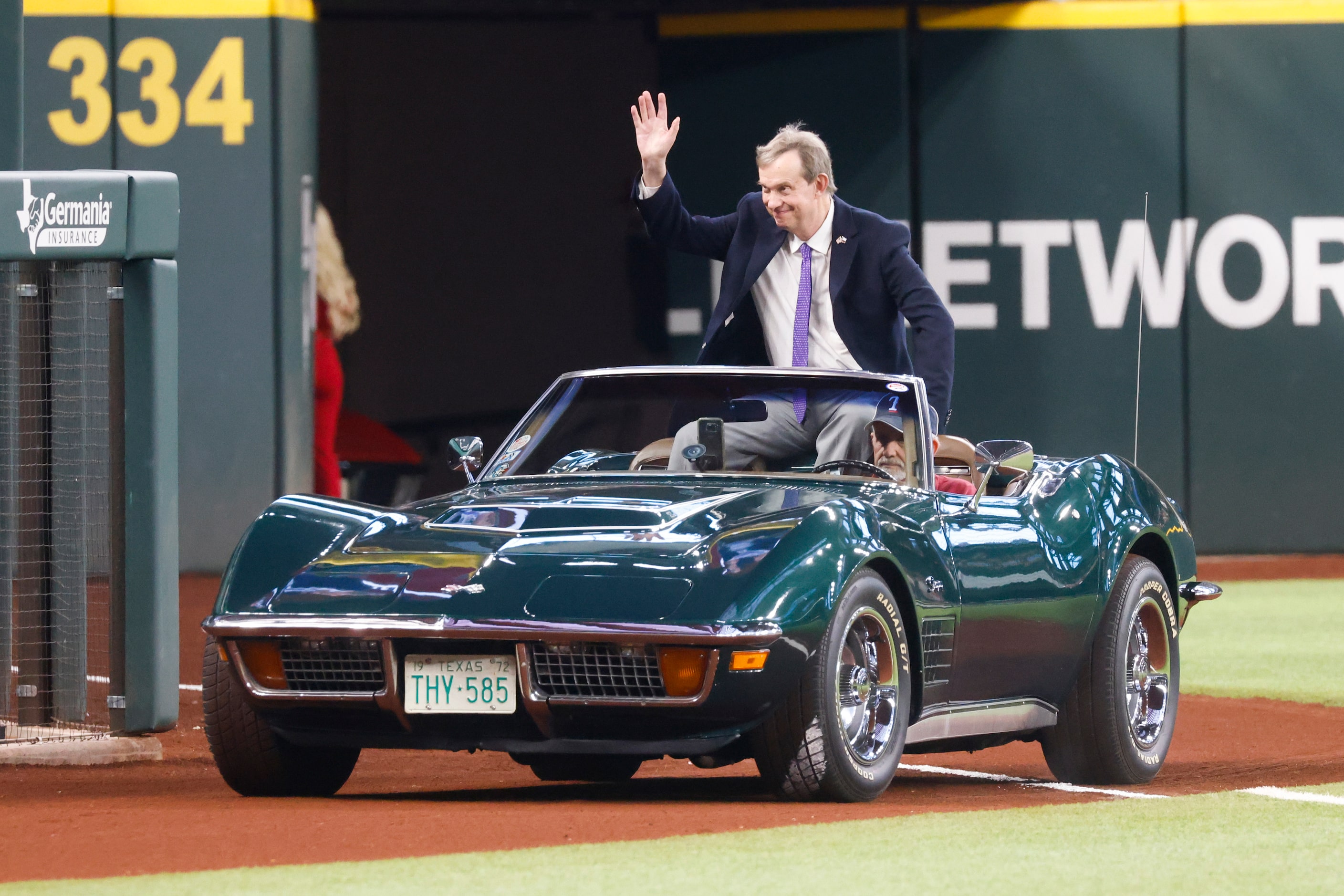 Texas Rangers media VP John Blake waves as he arrives at the induction ceremony at Globe...