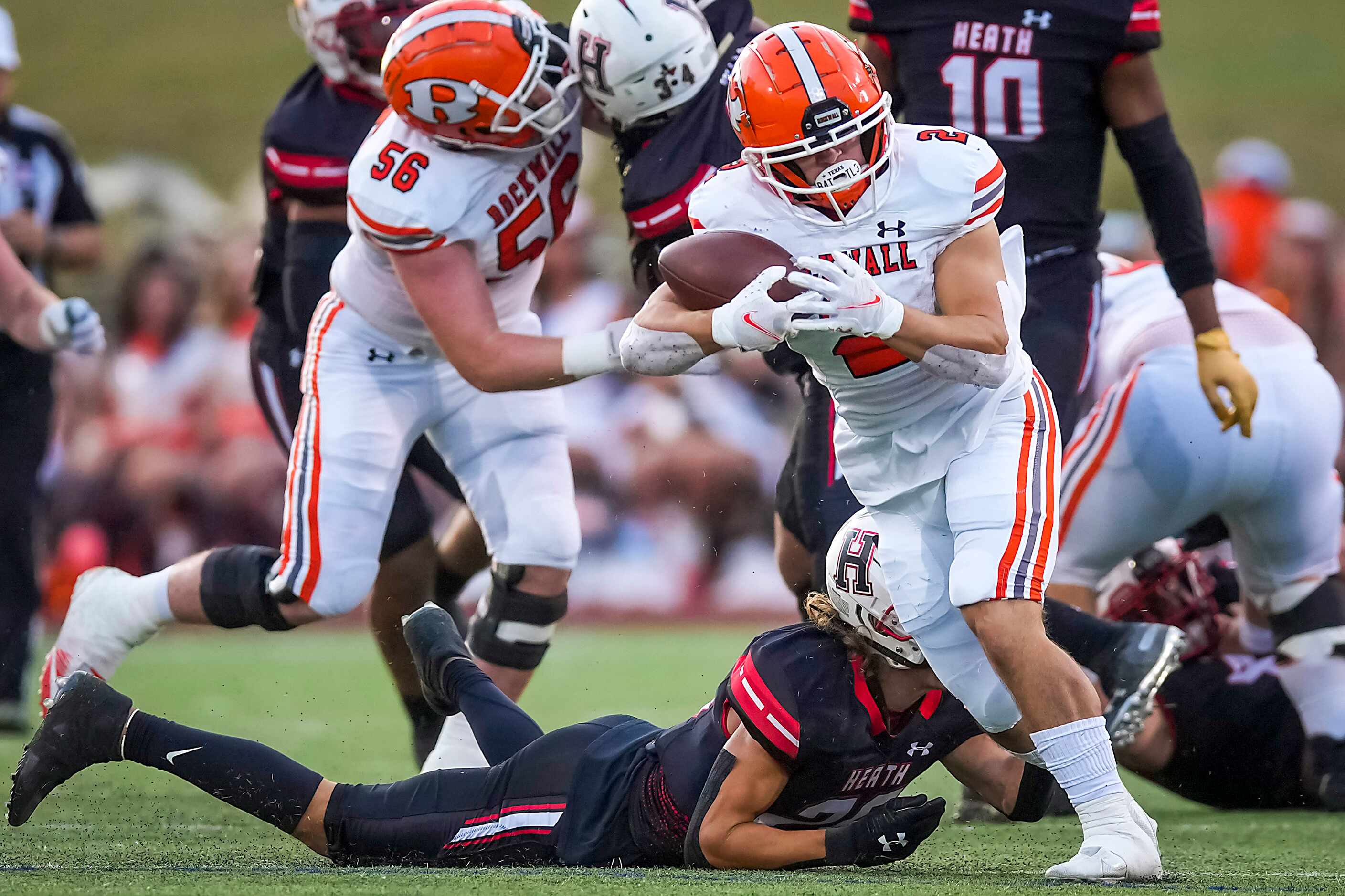 Rockwall running back  Zach Hernandez (2) breaks into the Rockwall-Heath secondary during...