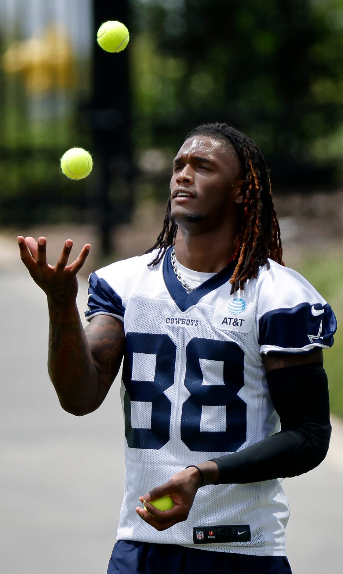 Dallas Cowboys wide receiver CeeDee Lamb (88) works on his ball juggling skills during...