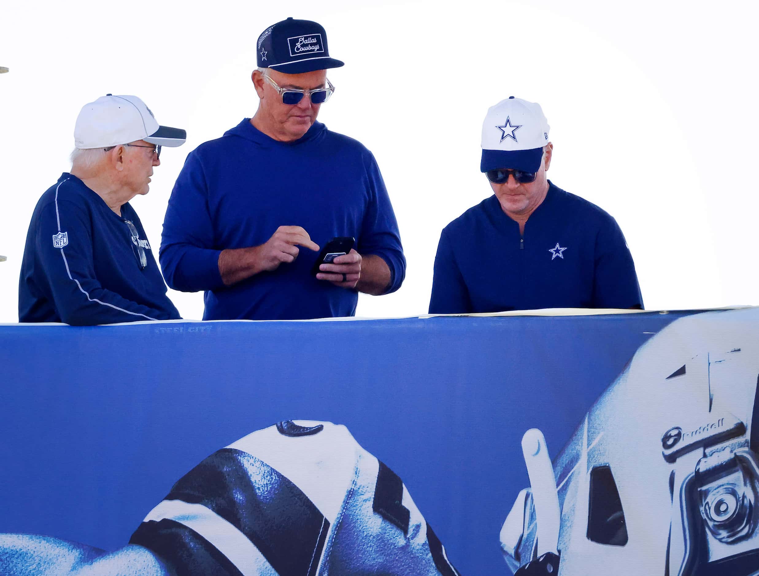 Dallas Cowboys owner Jerry Jones (left), COO Stephen Jones and sales and marketing officer...
