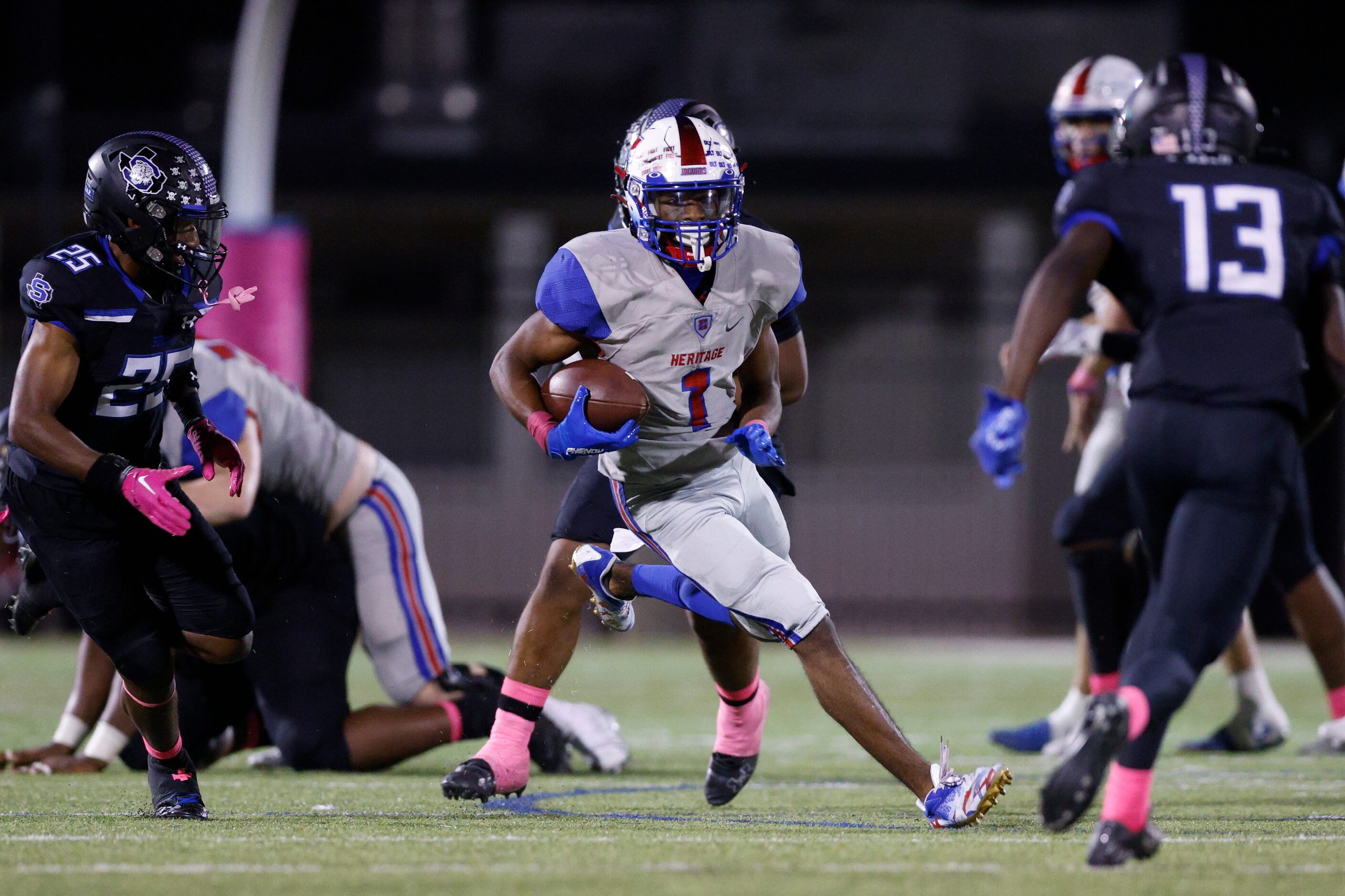 Midlothian Heritage wide receiver T.J. Pride (1) runs between Mansfield Summit defensive...