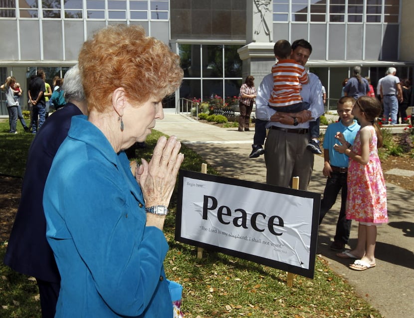 Elaine Blankenship of Kaufman takes part in a prayer walk around the Kaufman County...